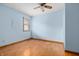 Cozy bedroom with hardwood floors, blue walls, and natural light at 7018 W Anton Way, New Palestine, IN 46163