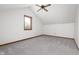 Simple bedroom with a carpeted floor, single window, ceiling fan and is painted white at 7018 W Anton Way, New Palestine, IN 46163