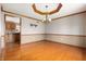 Open dining room featuring hardwood floors with a view of the kitchen at 7018 W Anton Way, New Palestine, IN 46163
