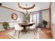 Well-appointed dining room featuring elegant decor, stylish furniture, and hardwood floors at 7018 W Anton Way, New Palestine, IN 46163