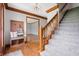 Spacious foyer with hardwood floors, staircase, coat rack and bench at 7018 W Anton Way, New Palestine, IN 46163