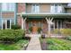 Close-up of a home's inviting front porch with a decorative door and manicured landscaping at 7018 W Anton Way, New Palestine, IN 46163