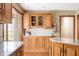 Charming kitchen featuring wood cabinetry, granite countertops, and a bright, airy feel at 7018 W Anton Way, New Palestine, IN 46163