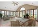 Bright sunroom with vaulted ceilings, tile flooring, and ample natural light perfect for relaxing and entertaining at 7018 W Anton Way, New Palestine, IN 46163