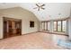Open sunroom with vaulted ceiling, tile flooring, and large windows offer ample natural light at 7018 W Anton Way, New Palestine, IN 46163