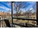 Balcony with outdoor seating offering views of the community and trees at 8690 Jaffa Ct W Dr # 18, Indianapolis, IN 46260
