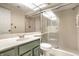 Well-lit bathroom featuring a vanity and shower with glass doors at 8690 Jaffa Ct W Dr # 18, Indianapolis, IN 46260