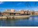 Community buildings overlooking a pond surrounded by well maintained landscaping at 8690 Jaffa Ct W Dr # 18, Indianapolis, IN 46260