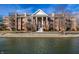 An inviting brick condo with balconies, columns, and waterfront views at 8690 Jaffa Ct W Dr # 18, Indianapolis, IN 46260