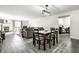 An open-concept living room with a dining area and fireplace offers cozy living at 8690 Jaffa Ct W Dr # 18, Indianapolis, IN 46260