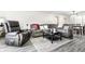 A well-lit living room features comfortable seating and an area rug at 8690 Jaffa Ct W Dr # 18, Indianapolis, IN 46260