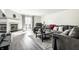 A cozy living room with a fireplace, plush seating, and sliding glass doors at 8690 Jaffa Ct W Dr # 18, Indianapolis, IN 46260