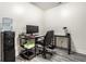 Home office with contemporary black desk and chair, plus a water cooler for convenience at 8690 Jaffa Ct W Dr # 18, Indianapolis, IN 46260