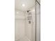 A shower with white tile and a silver shower rack for storage at 8690 Jaffa Ct W Dr # 18, Indianapolis, IN 46260