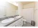 Bathroom features a double vanity, large mirror, and patterned tile floor at 9208 Hawley Dr, Indianapolis, IN 46216
