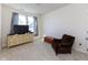 Bedroom with a TV, chest of drawers, and a plush armchair at 9208 Hawley Dr, Indianapolis, IN 46216