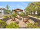 Enjoy a serene community space with a charming gazebo and inviting fire pit seating area for residents at 9208 Hawley Dr, Indianapolis, IN 46216