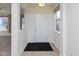 Bright foyer with a clean and neutral palette, showcasing wood floors and ample natural light at 9208 Hawley Dr, Indianapolis, IN 46216