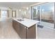 Modern kitchen island with stainless steel appliances and an open layout connecting to the living area at 9208 Hawley Dr, Indianapolis, IN 46216