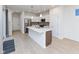 Bright kitchen with stainless steel appliances, modern white cabinets, and large center island at 9208 Hawley Dr, Indianapolis, IN 46216
