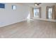 Spacious living room features wood floors, neutral walls, and large windows for abundant natural light at 9208 Hawley Dr, Indianapolis, IN 46216