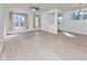 Bright and airy living room features wood floors, neutral tones, and ample natural light from large windows at 9208 Hawley Dr, Indianapolis, IN 46216