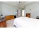 Light-filled main bedroom featuring a white bedspread, light green walls, and neutral carpet at 9208 Hawley Dr, Indianapolis, IN 46216