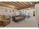Spacious finished basement with a large sectional and workout area at 11 Stratford Way, Danville, IN 46122
