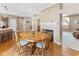 Comfortable dining area with a wooden table, fireplace, and a view of the living space at 11 Stratford Way, Danville, IN 46122