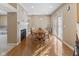 Bright dining area features hardwood floors, a fireplace, and sliding glass doors to the backyard at 11 Stratford Way, Danville, IN 46122