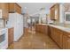 Large kitchen with hardwood floors, wood cabinets and access to the rest of the house at 11 Stratford Way, Danville, IN 46122