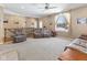 Bright living room with plush furniture, fireplace, and a large window overlooking the front yard at 11 Stratford Way, Danville, IN 46122