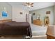 Large primary bedroom featuring soft carpet, lots of windows, and neutral colors at 11 Stratford Way, Danville, IN 46122