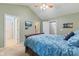 Vaulted ceilings accent the main bedroom featuring a wood sleigh bed, ceiling fan, carpet floors and ensuite bath access at 11130 Sanabria Dr, Indianapolis, IN 46235