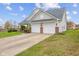 Two-car garage with an attached driveway at 11130 Sanabria Dr, Indianapolis, IN 46235
