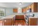 Functional kitchen with wood cabinets and ample counter space at 11130 Sanabria Dr, Indianapolis, IN 46235