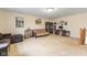 Spacious living room with comfortable seating, including couches, a futon, and ample space for activities at 11130 Sanabria Dr, Indianapolis, IN 46235