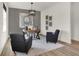 Stylish study features modern lighting, decor, light wood floors and comfortable seating at 11730 Cotterill Way, Indianapolis, IN 46235
