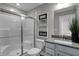 Bathroom with a glass shower door, light gray tiling, and modern fixtures at 1265 Sika Ln, Greenwood, IN 46143