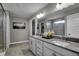 Elegant bathroom with double vanity, modern fixtures, and glass-enclosed shower provides a luxurious experience at 1265 Sika Ln, Greenwood, IN 46143