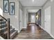 Bright entryway with gray walls, hardwood floors, staircase, and modern decor at 1265 Sika Ln, Greenwood, IN 46143
