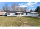 Charming single-story home featuring a well-maintained lawn and an attached two-car garage at 1408 W Banta Rd, Indianapolis, IN 46217