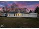 Charming single-story home featuring a well-maintained lawn and an attached two-car garage at 1408 W Banta Rd, Indianapolis, IN 46217