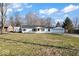 Charming single-story home with a well-manicured front yard, a two-car garage, and a welcoming entrance at 1408 W Banta Rd, Indianapolis, IN 46217