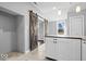 Open kitchen area featuring a sliding barn door and white countertops at 1408 W Banta Rd, Indianapolis, IN 46217