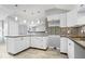 An open concept kitchen with new cabinets and modern pendant lighting at 1408 W Banta Rd, Indianapolis, IN 46217