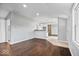 Spacious living room featuring hardwood floors, recessed lighting, and a sliding barn door at 1408 W Banta Rd, Indianapolis, IN 46217