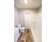 A standard bathroom with a tub, toilet, wood look flooring, and vanity sink at 1421 Shepard St, Indianapolis, IN 46221