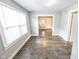 Open dining room featuring updated flooring, neutral paint and natural light at 1421 Shepard St, Indianapolis, IN 46221