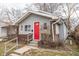 Charming single-Gathering home with gray siding, brick accents and a bright red front door at 1421 Shepard St, Indianapolis, IN 46221